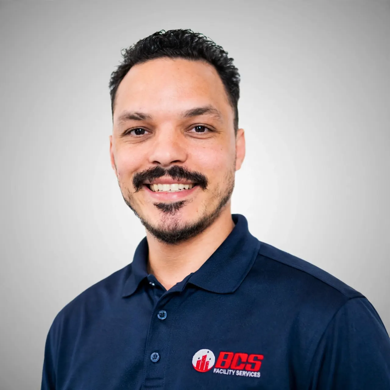 Daniel, owner and founder of Burgos Cleaning Service, wearing a navy BCS polo