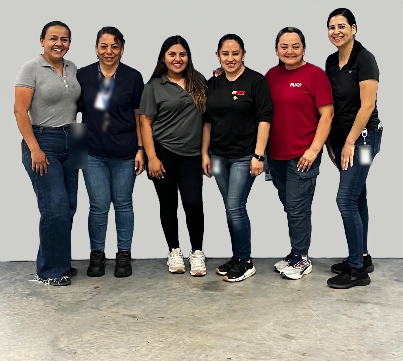 Six Burgos Cleaning team members standing together