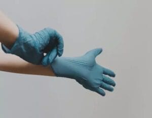 hand wearing gloves