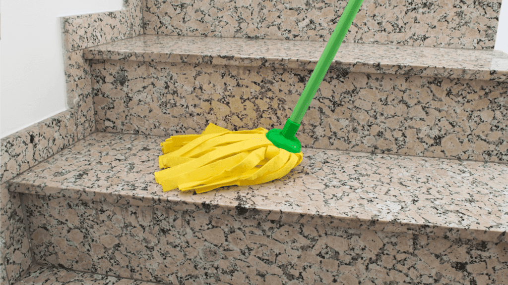 Using gentle cloth to clean granite