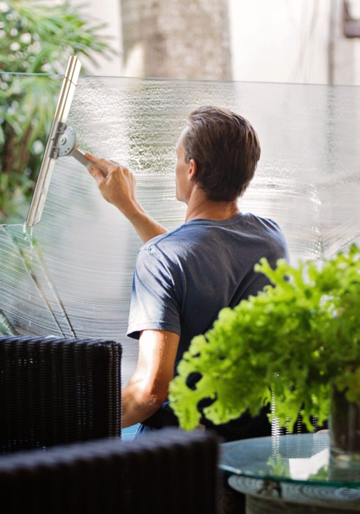 Man cleaning glass